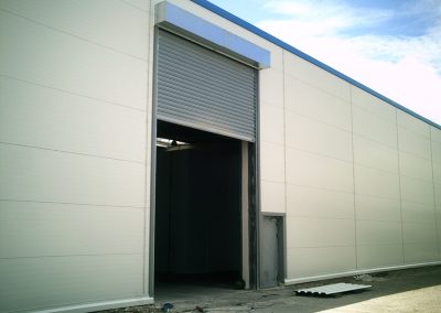 Rideau acier enroulable hangar